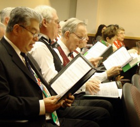 The Silver Toned Signers opened the annual gavel-passing ceremony with Christmas carols.