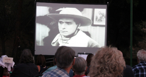 A sold out crowd watch a clip of William S. Hart at Silents Under the Stars to benefit the Friends of Hart Park.