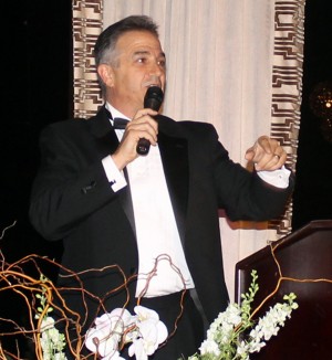Volunteer auctioneer Chris Fall hammered down $18,200 for 10 items in the live auction.