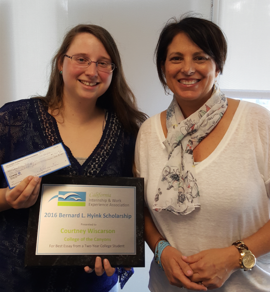 COC student Courtney Wiscarson accepts her $1,000 California Internship and Work Experience Association (CIWEA) scholarship check from Gina Bogna, COC assistant dean of Internships, Job Development, and Career Center. 