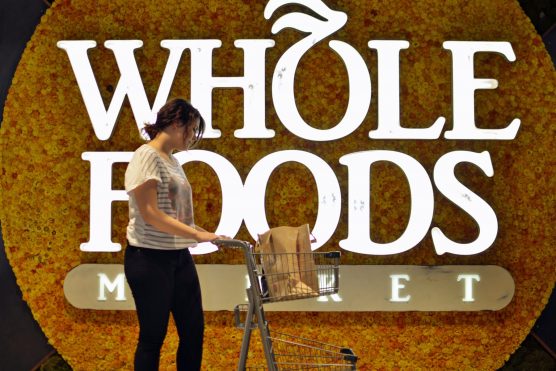 Whole Foods Market logo and shopper