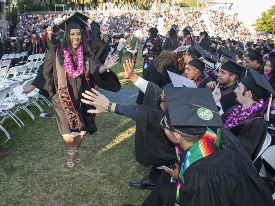 Newly minted graduates from the class of 2017 celebrate at the commencement ceremony for the College of Humanities and the College of Health and Human Development, on May 20, 2017 in front of the Delmar T. Oviatt Library. Photo by Luis Garcia.