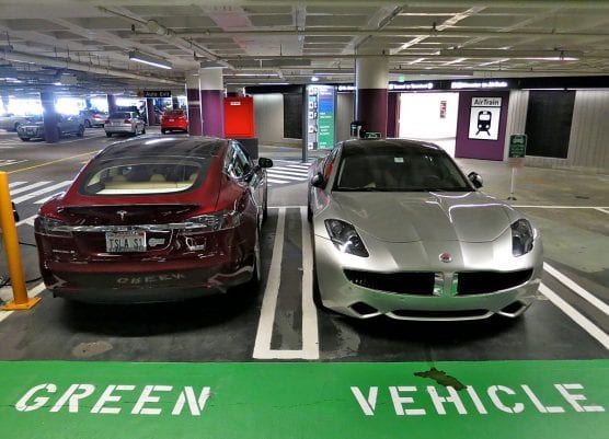 Tesla Model S electric car (left) and Fisker Karma plug-in hybrid at the parking spots reserved for green cars by Virgin Airlines at San Francisco International Airport. | Photo: Steve Jurvetson/WMC 2.0