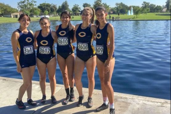 The College of the Canyons women's cross country team poses for a photo prior to running in the CCCAA Southern California Preview at Don Knabe Community Regional Park on Sept. 14, 2018 in Cerritos. | Photo: Lindie Kane/COC Sports Information.