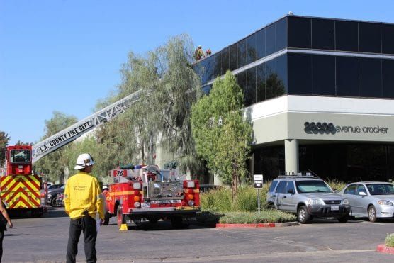 Firefighters determined a malfunctioning air conditioning unit on the roof at 28309 Avenue Crocker caused smoke to enter the building on Monday morning, Sept. 9, 2018. | Photo: Ryan Gilley/Two8Nine Media.