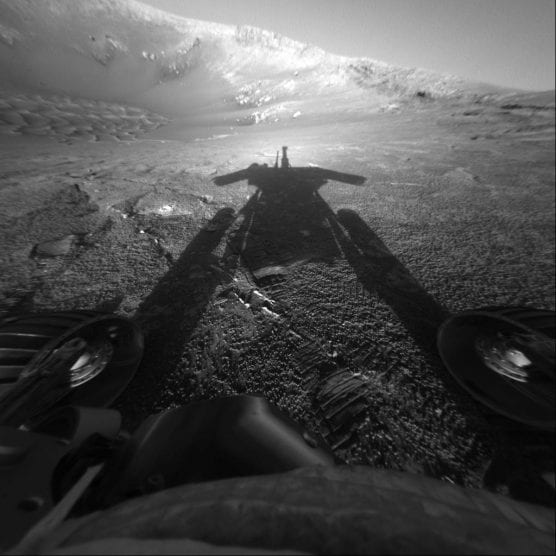 The dramatic image of NASA's Mars Exploration Rover Opportunity's shadow was taken on sol 180 (July 26, 2004) by the rover's front hazard-avoidance camera as the rover moved farther into Endurance Crater in the Meridiani Planum region of Mars. | Photo: NASA/JPL-Caltech.