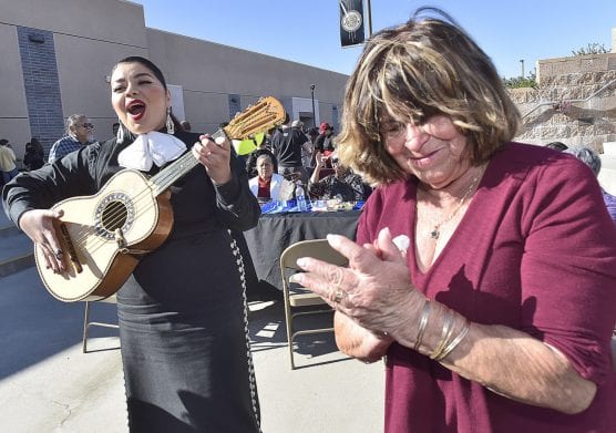 Raquel Guerrera, right, applauds after singing along with Wendy Alarcon of Mariachi Las Catrinas at the Golden Valley High School Quinceanera, celebrating 15 years of growth and excellence held at Golden Valley High School in Santa Clarita on Saturday. | Photo: Dan Watson/The Signal.