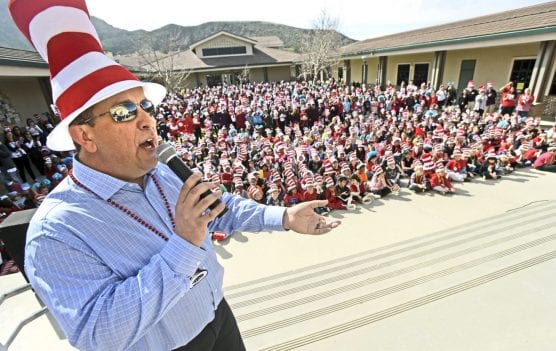 Teacher Ken Newton begins the proceedings as hundreds of students wear Dr. Suess costumes in order to be counted for the Guinness Book of World Records during the Read Across America event held at Fair Oaks Ranch Community School in Canyon Country on Friday. | Photo: Dan Watson/The Signal.