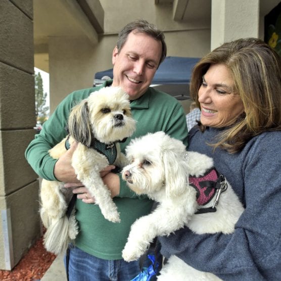 Scott and Vanessa Wilk with rescue dogs, Simi, left, and AV. | Photo: Dan Watson/The Signal. doggy donor bill