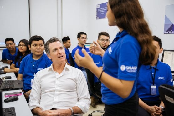 Governor Gavin Newsom hears from at-risk youth participating in a USAID coding class whose funding is being threatened by the Trump Administration’s cut to Central American aid. Photo credit: Eduardo Ezequiel. 