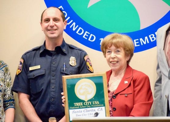 Mayor Marsha McLean receives a plaque from David Haas, with Cal Fire, for the city of Santa Clarita's recognition as 'Tree City USA' for the 29th year in a row from the Arbor Day Foundation on Tuesday, April 23. | Photo: Tammy Murga/The Signal.