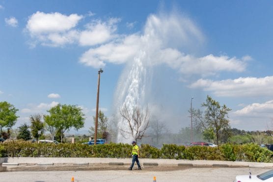 A broken water main sends water and rocks shooting more than 20 feet into the air on the 23300 block of Valencia Boulevard on Tuesday afternoon. | Photo: Cory Rubin/The Signal.