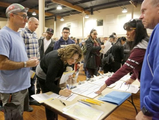Volunteers fill out forms at The Centre in Santa Clarita as they prepare to participate in the annual homeless count on Tuesday, Jan. 23, 2018. | Photo: Nikolas Samuels/The Signal.