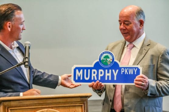 Santa Clarita City Manager Ken Striplin presented Intergovernmental Relations Manager Mike Murphy with a street sign in recognition of 25 years of service on Tuesday, July 30, 2019, during a farewell party ahead of his retirement on Aug. 2. | Photo: Tammy Murga/The Signal.