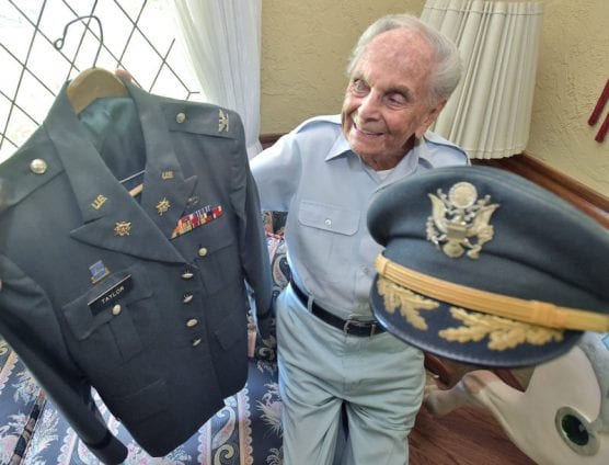 U.S. Army Colonel Eugene Taylor displays his WWII uniform. | Photo: Dan Watson/The Signal.