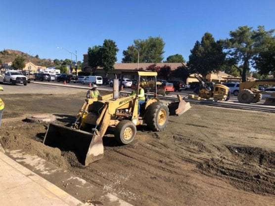 Construction crews work to restore the road heading eastbound after a water main break at Newhall Ranch Road and Bouquet Canyon Road. | Photo: Perry Smith/The Signal.