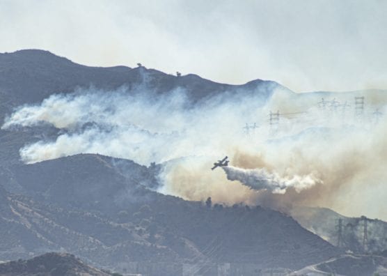 blaze - A Super Scooper aircraft drops water on flames in the foothills surrounding Santa Clarita as part of the battle against the Saddleridge Fire Friday morning, October 11, 2019. | Photo: Bobby Block/The Signal.
