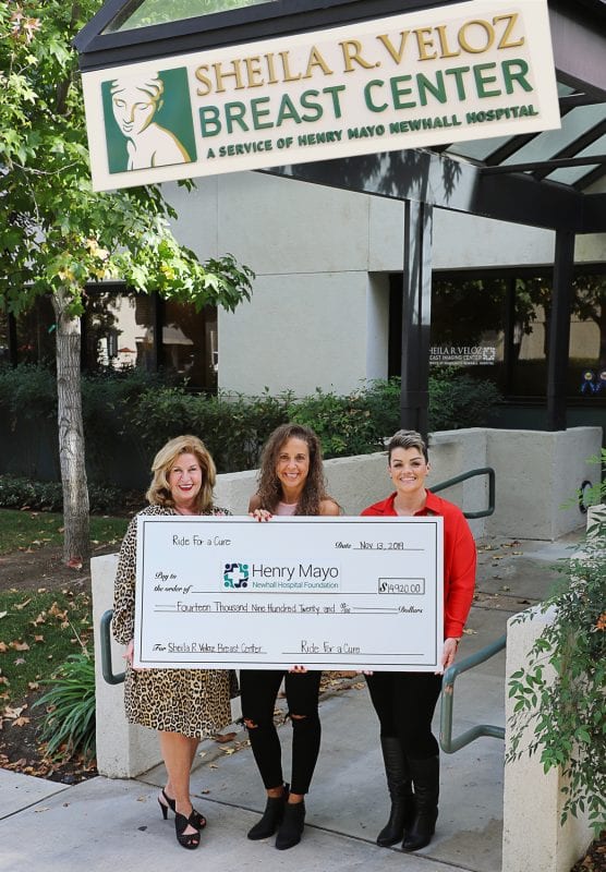 Event organizer Janet Cheveres (center) presents a check for nearly $15,000 to Henry Mayo Newhall Hospital Foundation President Marlee Lauffer (left) and Mara Shay, RN, Manager, Sheila R. Veloz Breast Center (right).