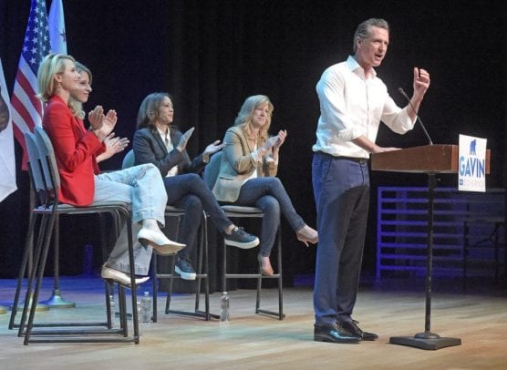 special election - Gavin Newsom, then-candidate for Governor of California, speaks at the podium during a campaign rally held at the Newhall Family Theater in Newhall on Saturday, November 3rd, 2018, as he is applauded by (from left): Newsom's wife Jennifer Siebel Newsom; Katie Hill, candidate for Congress; Kamala Harris, U.S. Senator; and Christy Smith, candidate for California Assembly. | Photo: Dan Watson / The Signal.
