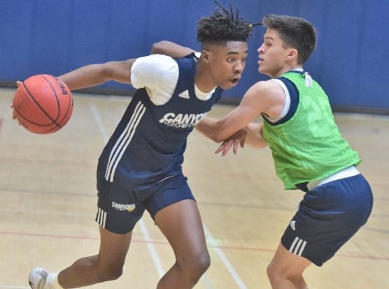 basketball preview - Christopher Bradford (14) drives to the basket against Joel Carrillo (20) during practice at COC on Friday. | Photo: Dan Watson / The Signal.