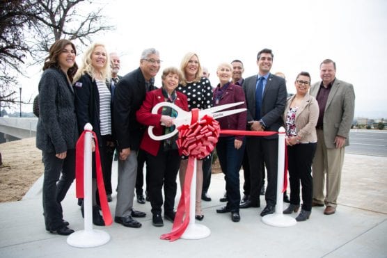 Members of the Santa Clarita City Council and other dignitaries cut the ribbon for the Newhall Ranch Road bridge widening project in February 2019. | Photo: Cory Rubin / The Signal.