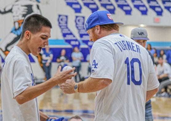 A student at Saugus High School expresses joy as he is handed a signed baseball from Los Angeles Dodgers player Justin Turner (10) at a pep rally where the team visited his school on January 24, 2020. | Photo: Bobby Block / The Signal.