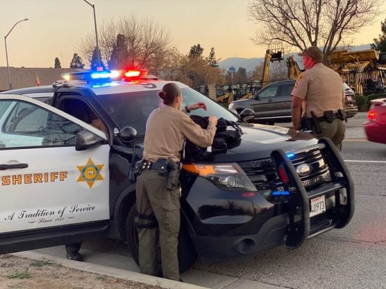 search in newhall - Deputies search the northbound side of Railroad Avenue Wednesday after a suspect reportedly fled from a deputy while the officer was trying to detain him. | Photo: Bobby Block / The Signal.
