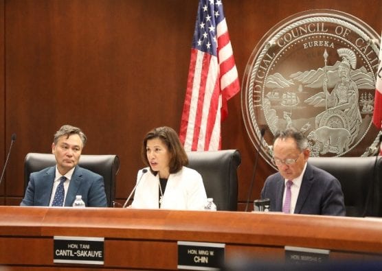 California Chief Justice Tani Cantil-Sakauye, flanked by Judicial Staff Director Martin Hoshino (L) and Justice Ming Chin (R) at a 2019 meeting of the Judicial Council. Courtesy photo.